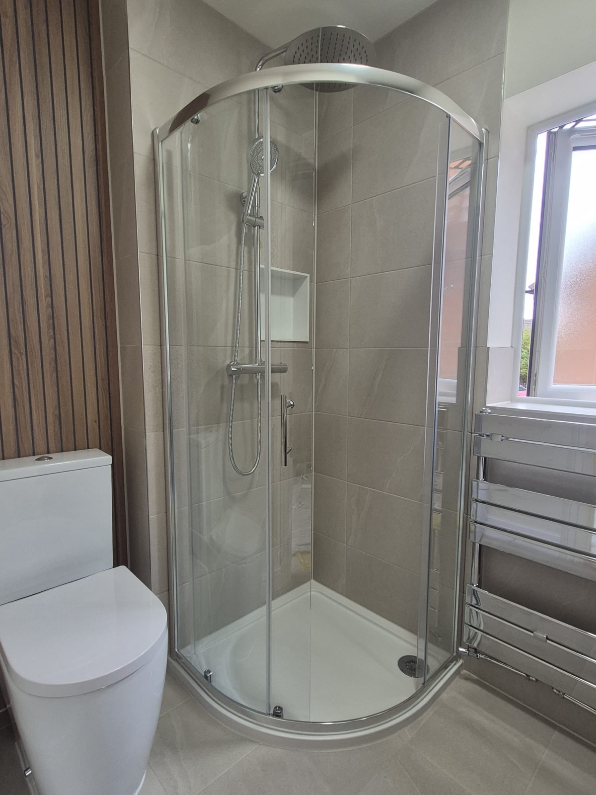 Ensuite rebuilt with a walnut vanity and slat walls