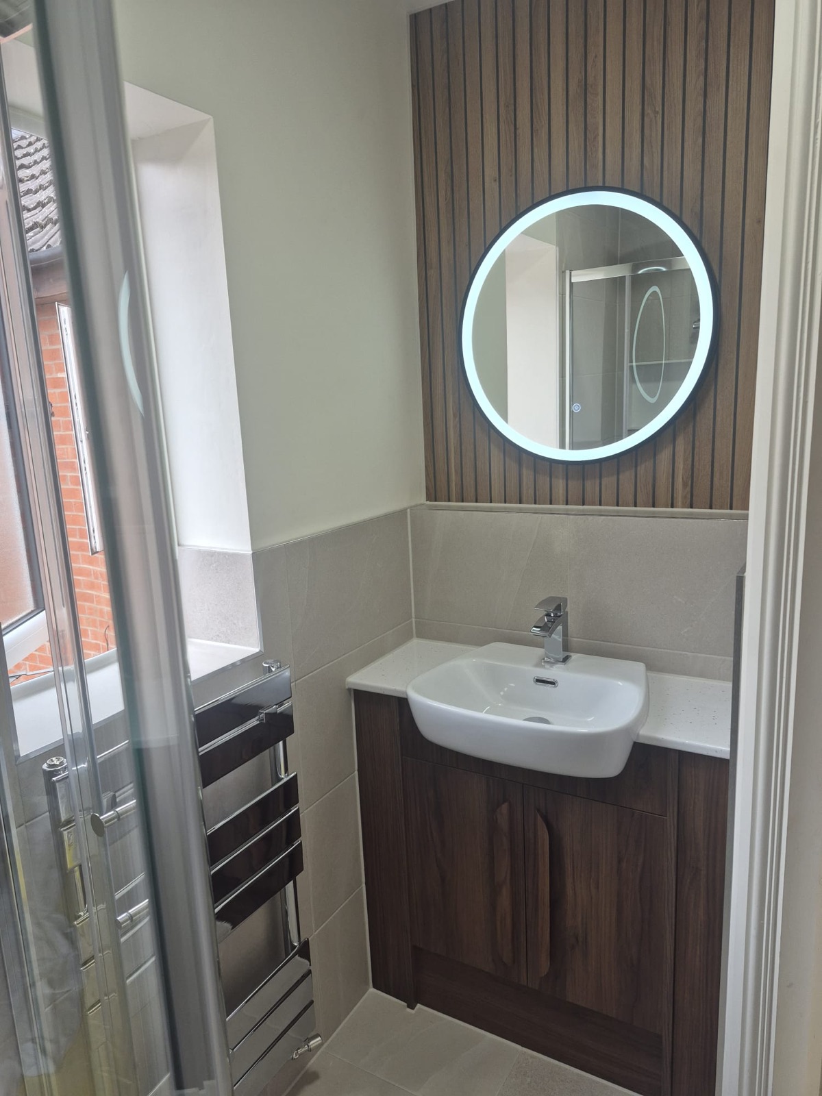 Ensuite rebuilt with a walnut vanity and slat walls
