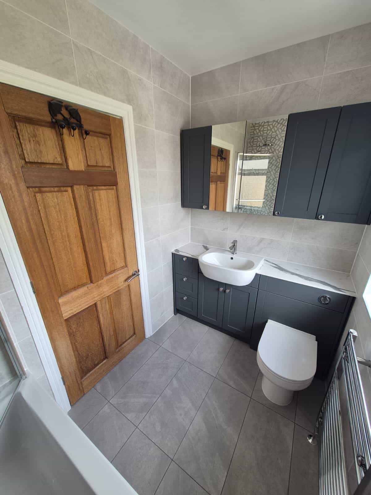Fitted navy vanity and storage