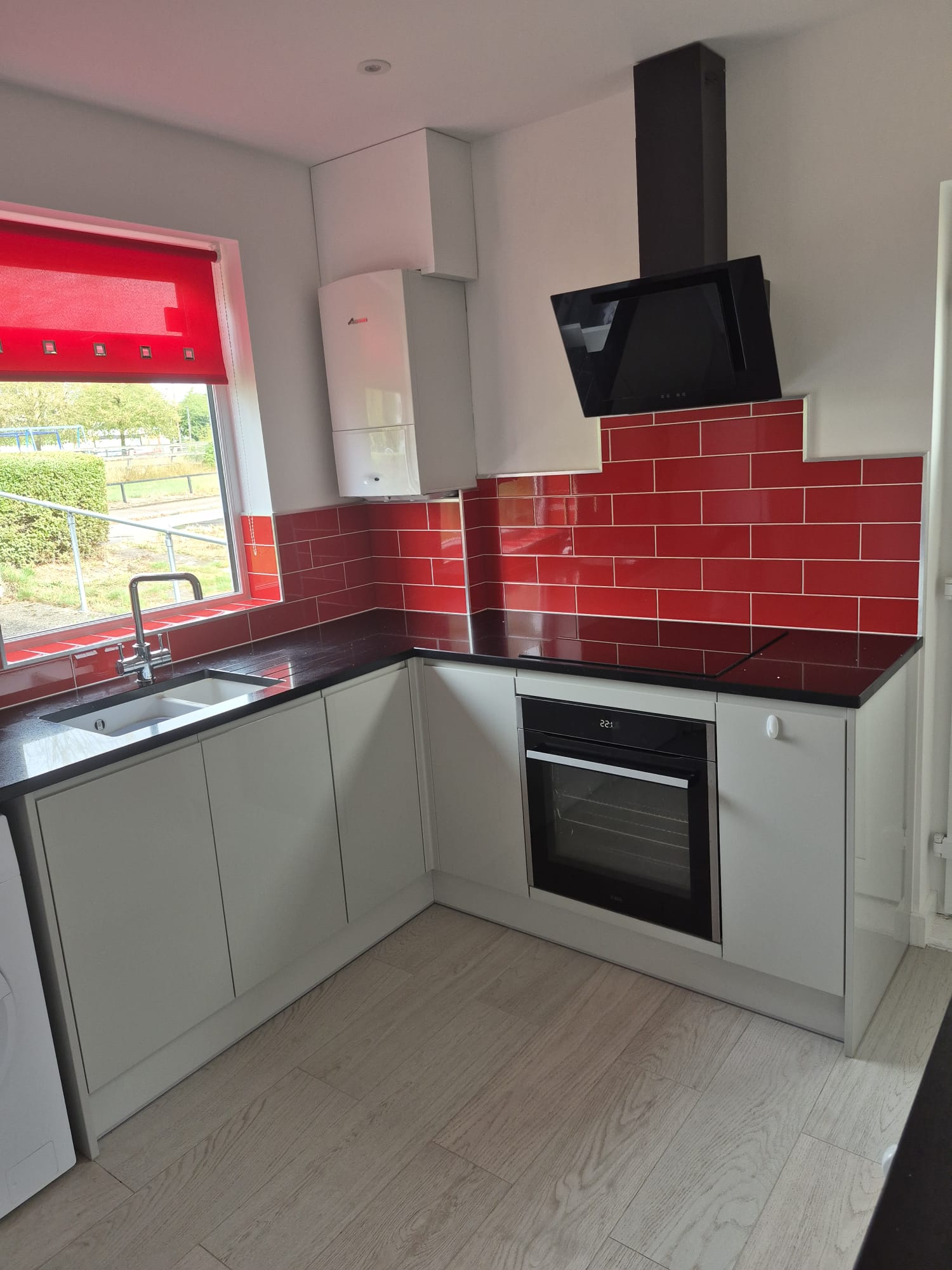 Kitchen stripped back to brick and rebuilt in gloss cashmere