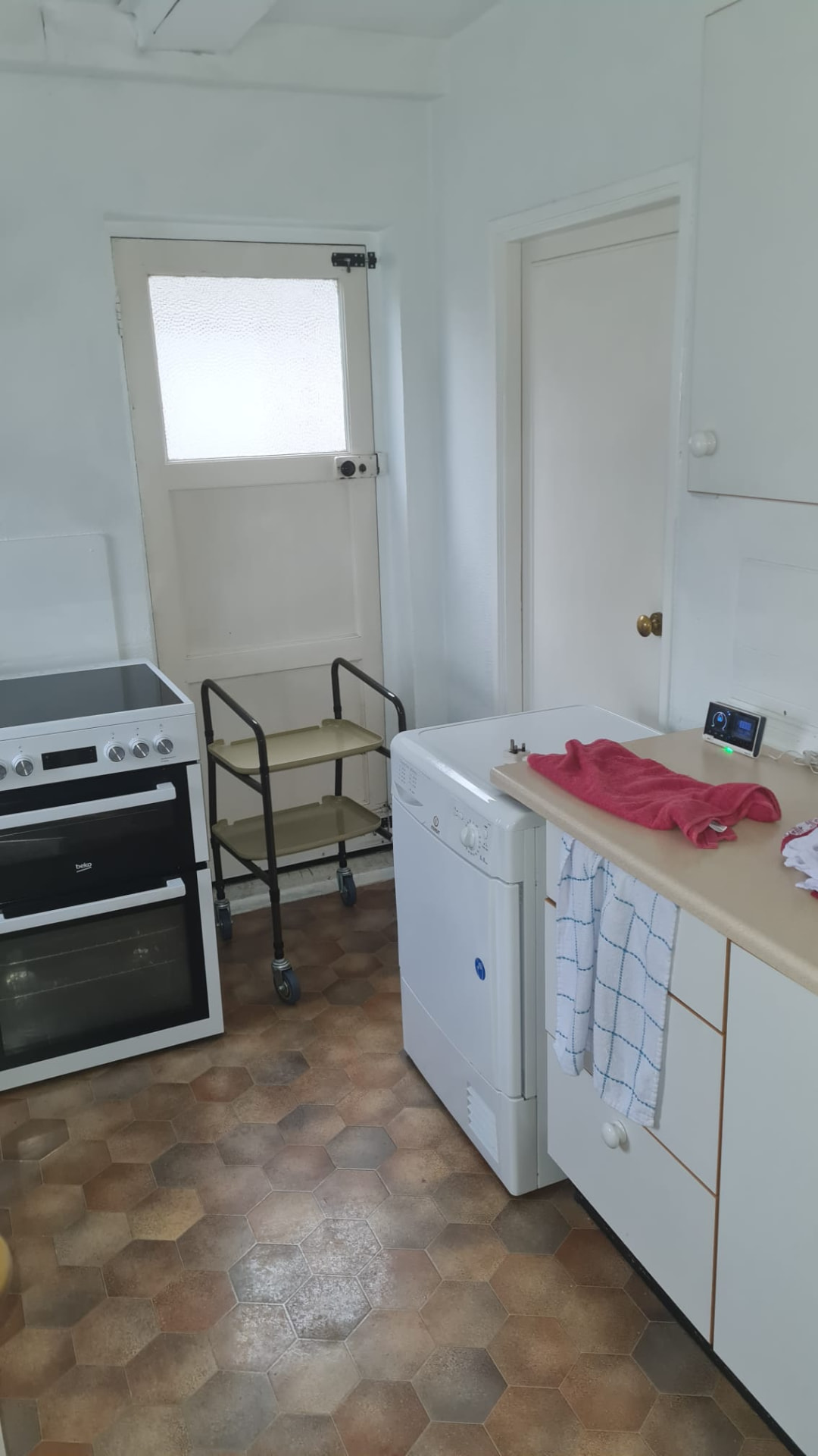 Kitchen stripped back to brick and rebuilt in gloss cashmere — before 1