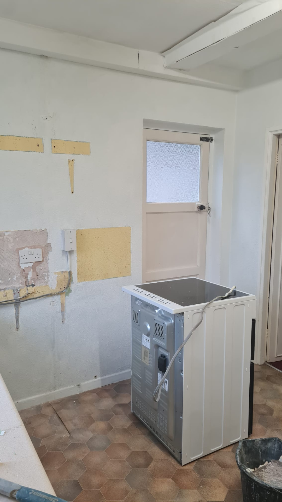 Kitchen stripped back to brick and rebuilt in gloss cashmere — step 1