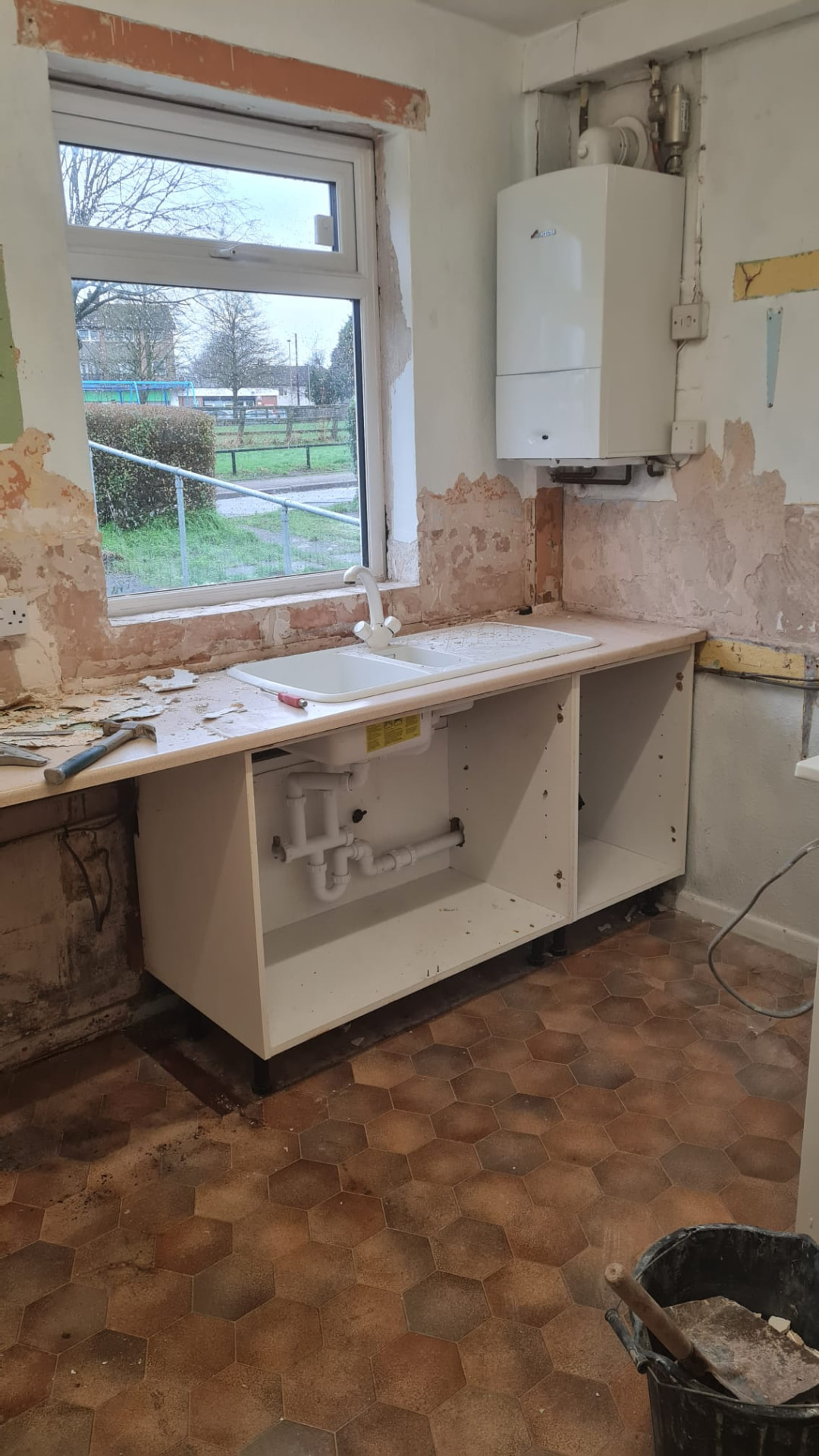 Kitchen stripped back to brick and rebuilt in gloss cashmere — step 4