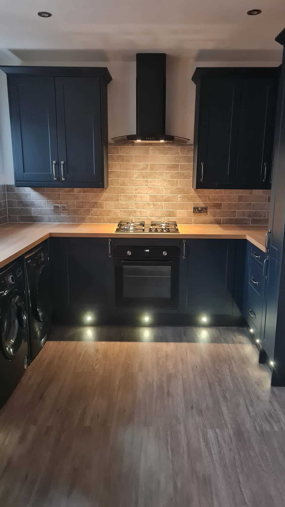 Dark blue shaker kitchen, stripped and rewired