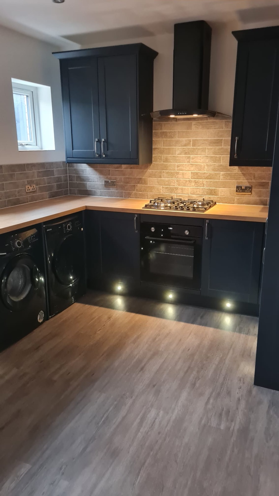 Dark blue shaker kitchen, stripped and rewired