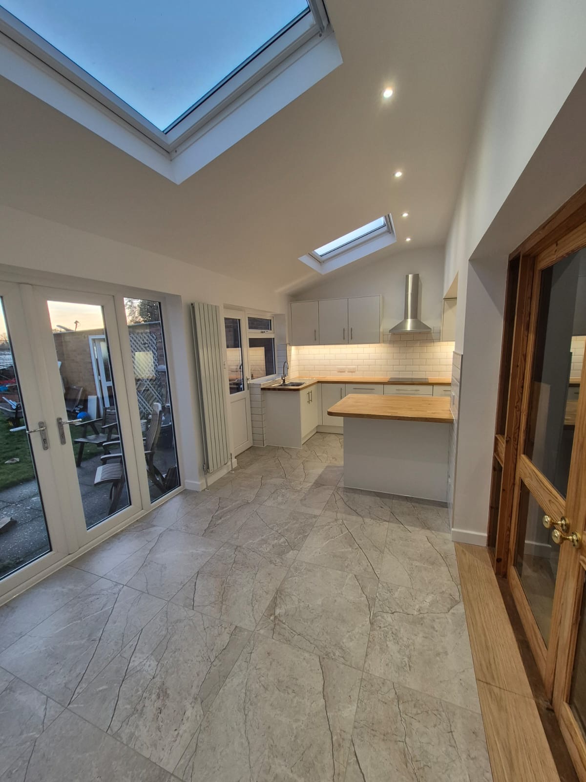 Rugby kitchen opened up, with oak worktops