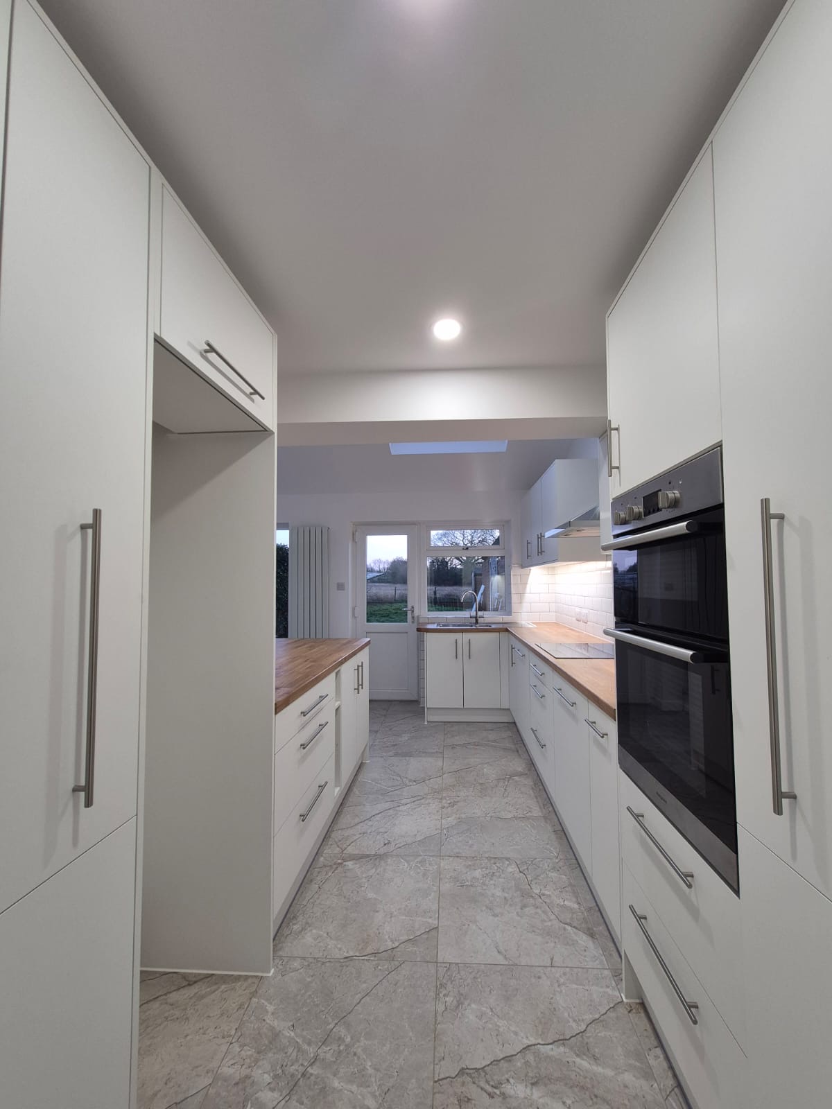 Rugby kitchen opened up, with oak worktops