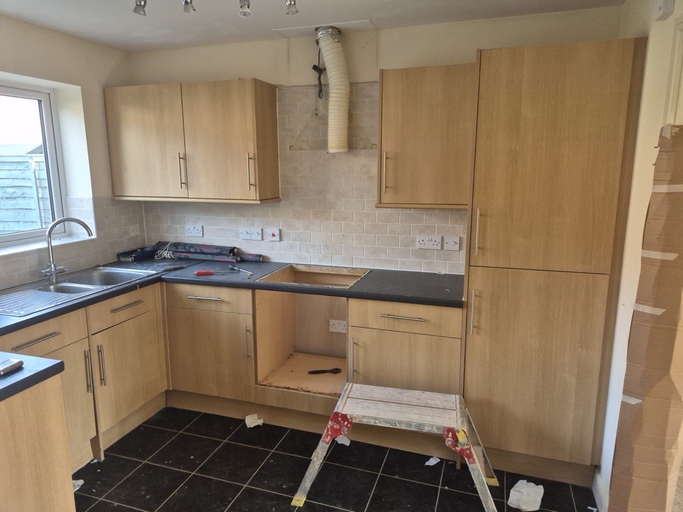 Sage shaker kitchen, fitted from a full strip-out — before 1