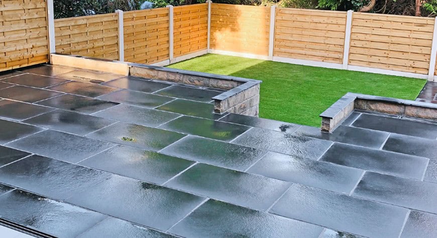 Black porcelain patio with raised lawn