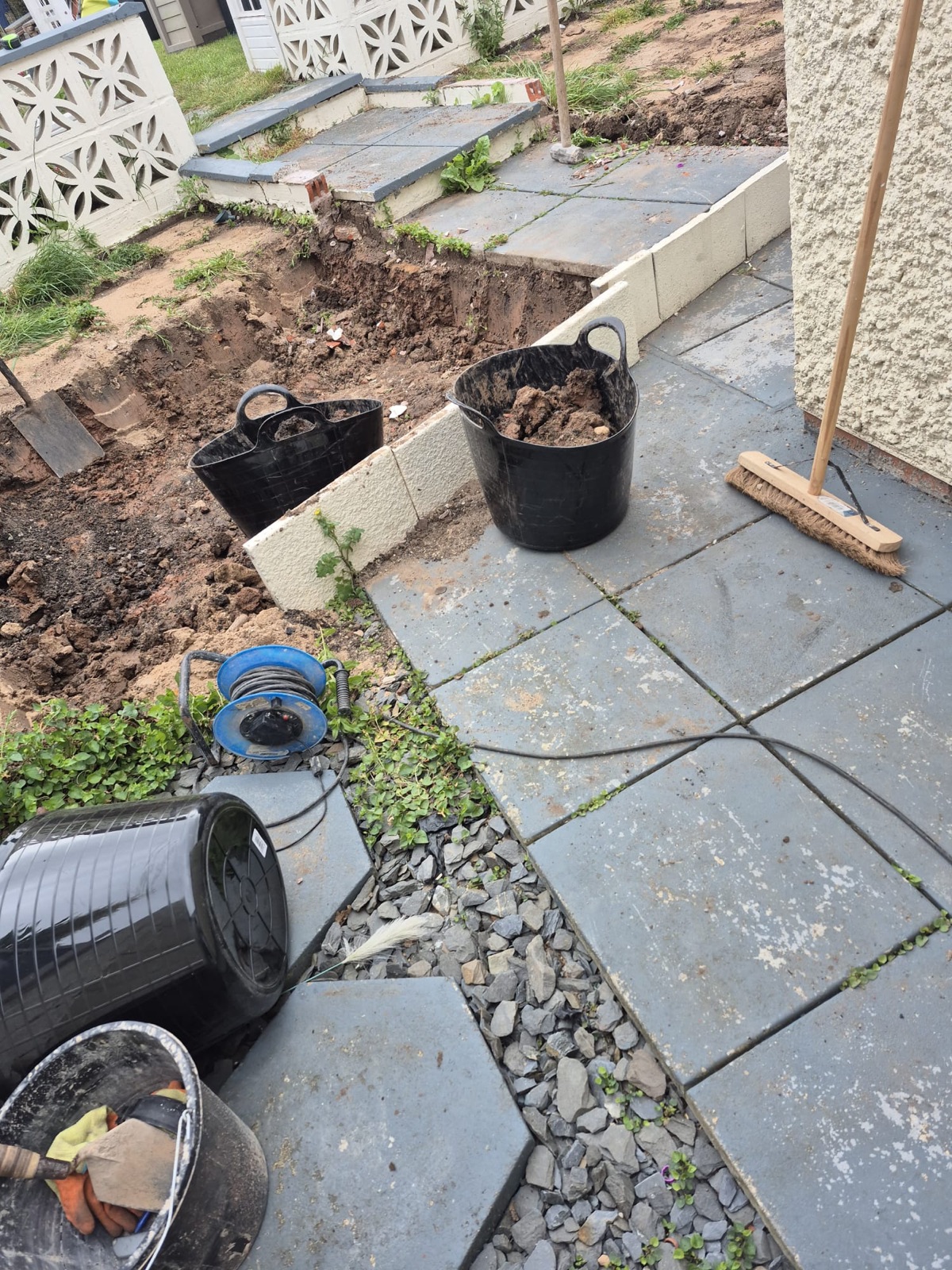 Porcelain patio with sleeper beds and steps — step 1