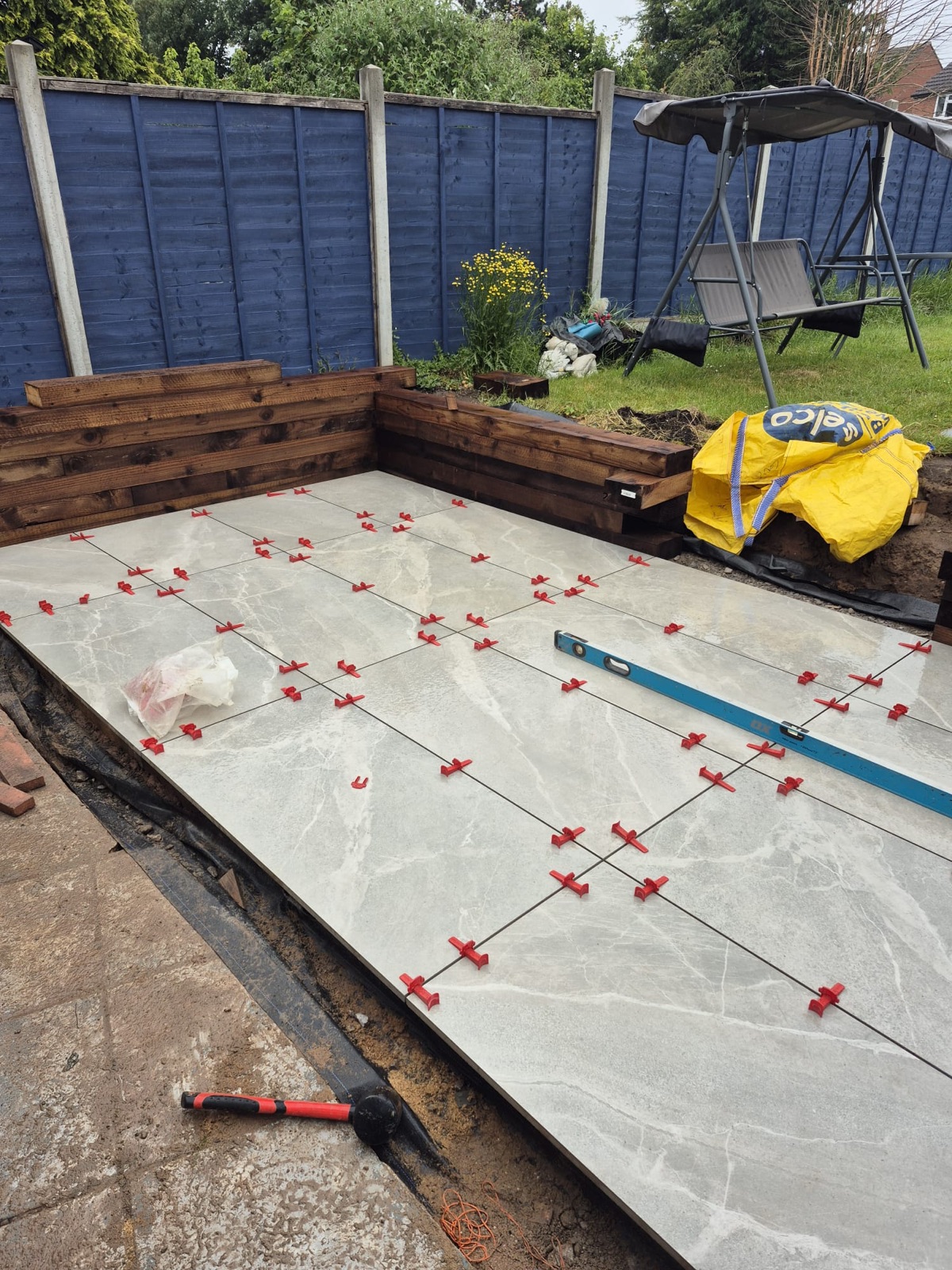 Porcelain patio with sleeper beds and steps — step 3