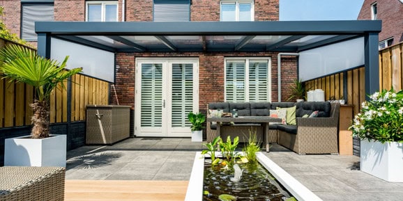 Grey veranda over a paved terrace